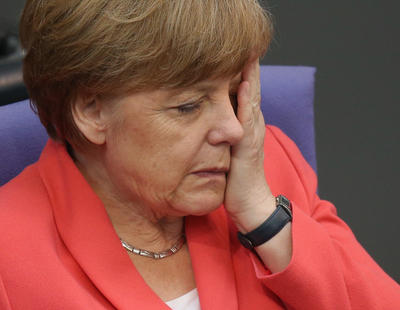 Merkel no disimula su reacción cuando Rajoy le dice que Podemos va segundo en los sondeos